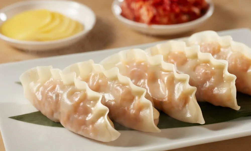 Glossy steamed shrimp dumplings arranged on a bamboo leaf plate at Good Alley, a Chinese restaurant in Arcadia