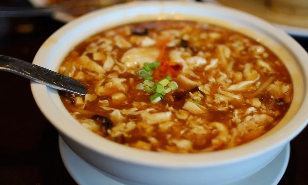 Hot and sour soup filled with tofu, egg strips and chopped green onion at Good Alley, a Chinese restaurant in Arcadia